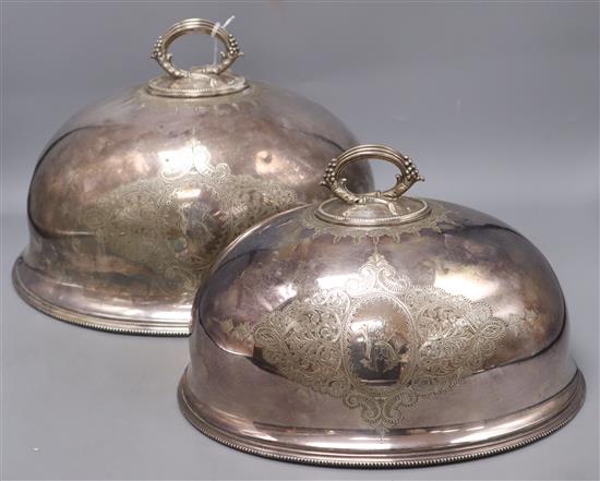 Two Victorian silver plated meat dish covers, largest 35 x 28cm